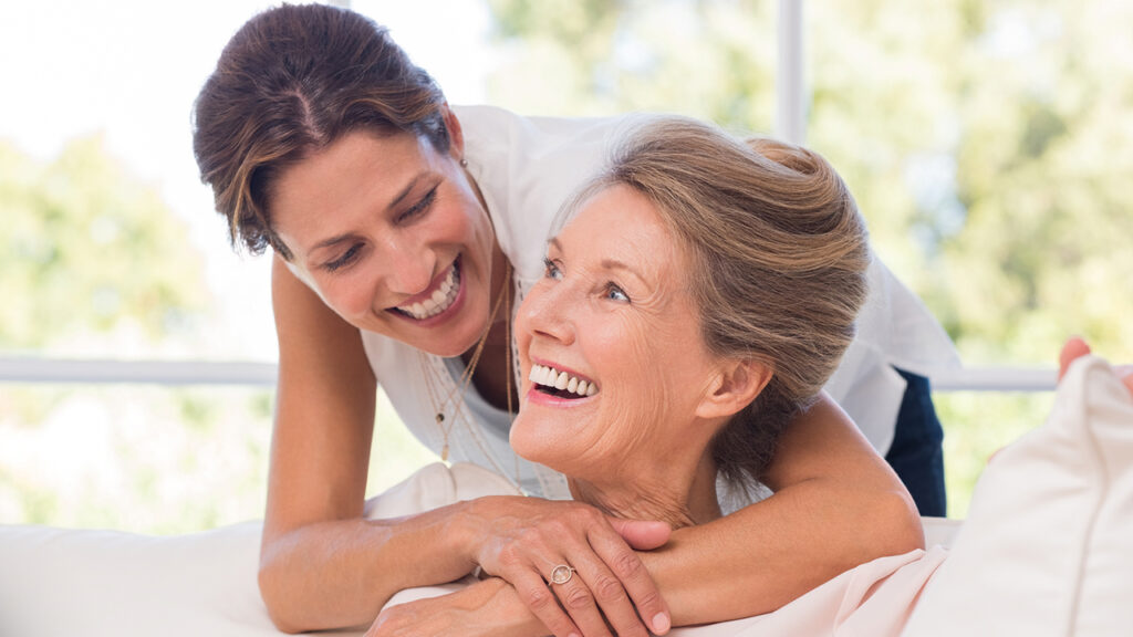 portrait of mother and daughter hugging. happy senior mother and