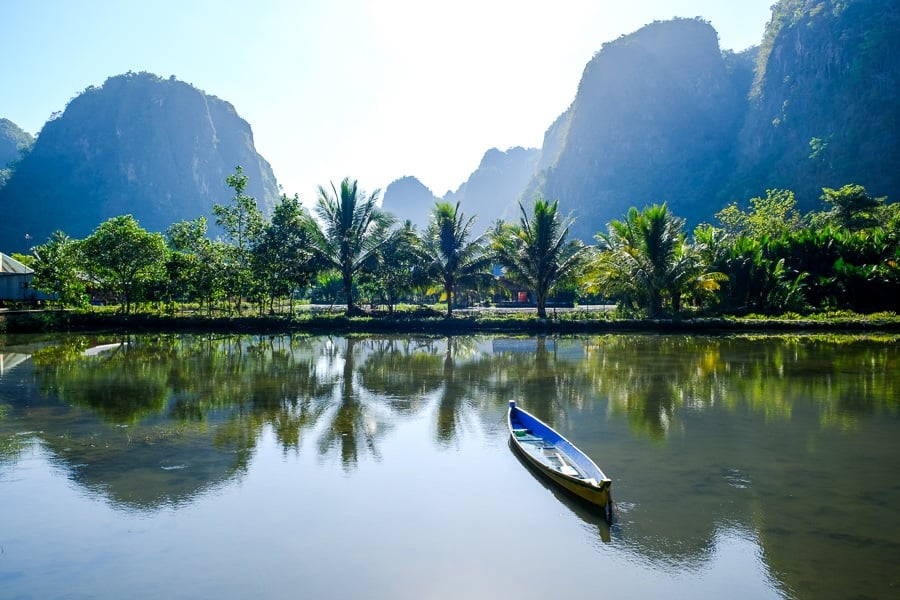 Canoe and reflection in the pond at Rammang Rammang Maros in Sulawesi