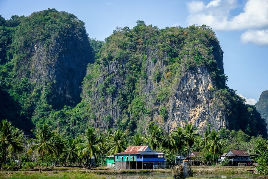 Giant karst mountains and old house at Rammang Rammang village in Sulawesi