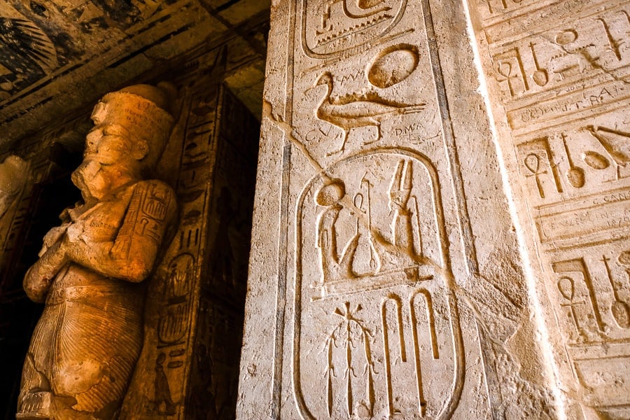 Statue and inscriptions inside Abu Simbel Temple in Egypt