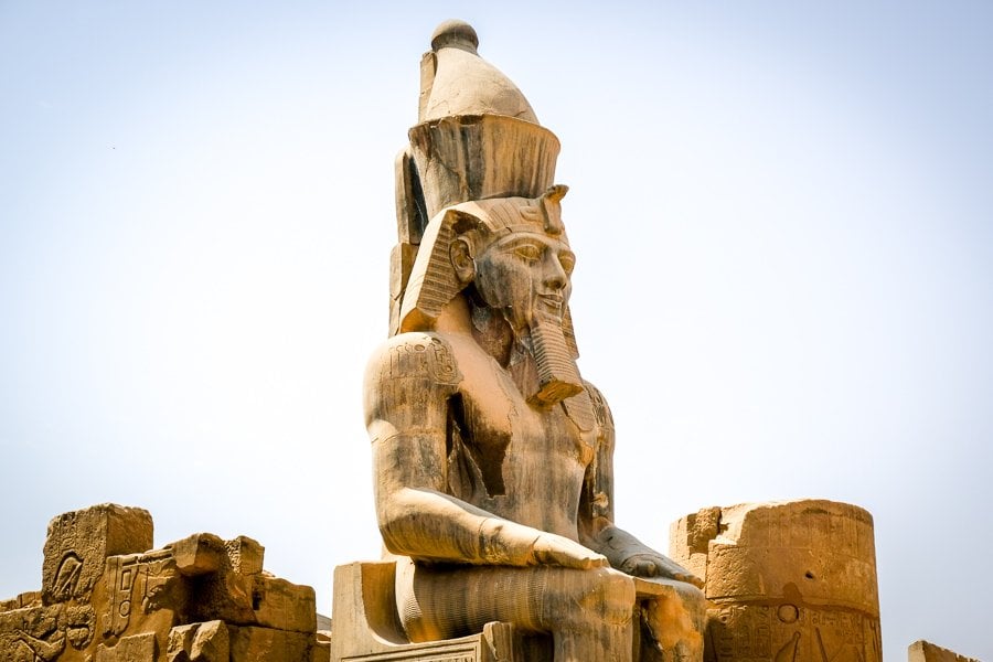 Statue of Rameses II sitting on a throne at Luxor Temple in Egypt