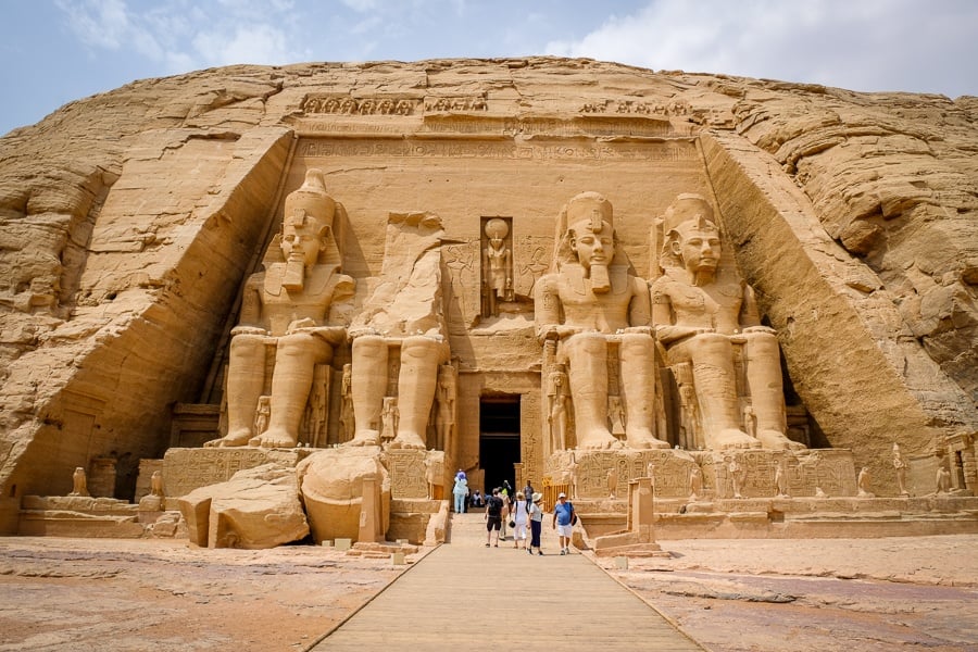 Tourists walking outside Abu Simbel Temple in Egypt