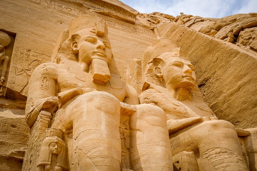 Looking up at the giant pharaoh statues of Abu Simbel Temple in Egypt