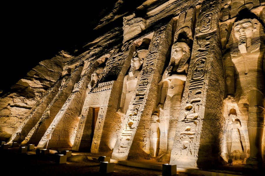 Queen's temple at Abu Simbel lit up at night in Egypt