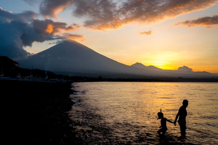 Father and son at the Amed Beach sunset in Bali