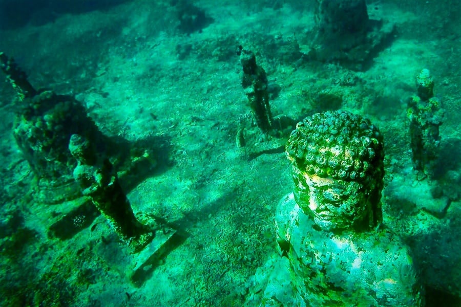 Underwater Buddha statue and temple ruins near Nusa Penida and Nusa Lembongan in Bali