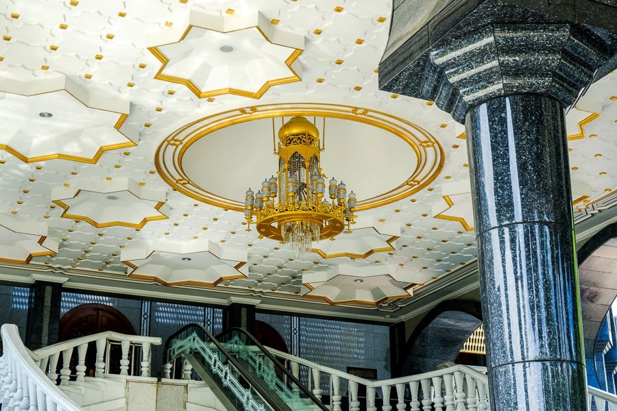 Stairways and gold chandelier at the Jame'Asr Hassanil Bolkiah mosque in Brunei