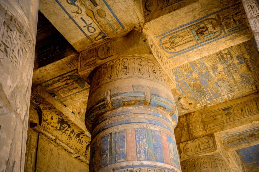 Hieroglyphs on the pillars at Medinet Habu Temple in Egypt