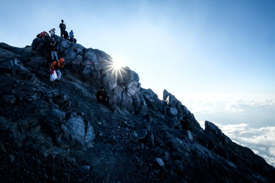 Hikers at the Mount Agung volcano crater in Bali