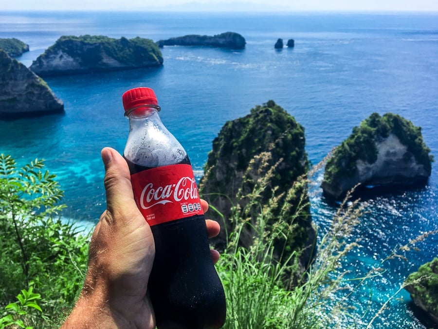 Holding Coca Cola at the Raja Lima viewpoint