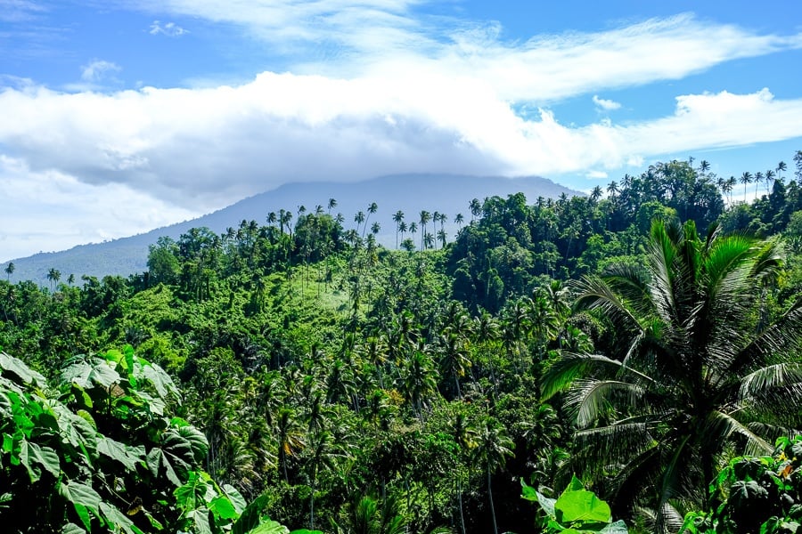 Volcano in the clouds and jungle near Tunan Waterfall in Sulawesi