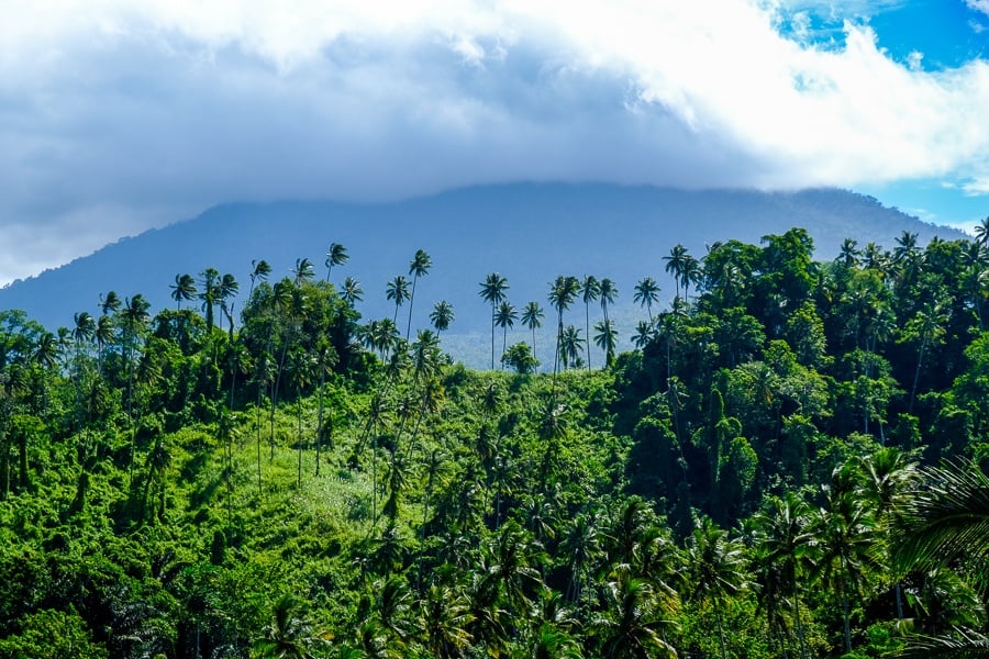 Volcano in the clouds and jungle near Tunan Waterfall in Sulawesi