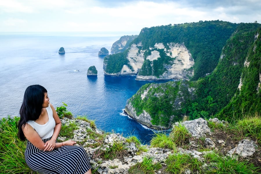 My woman staring at the coast at Saren Cliff Point in Nusa Penida, Bali