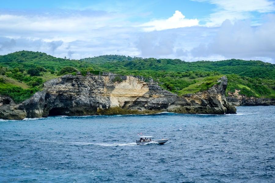 Speedboat near the coast at Broken Beach in Nusa Penida, Bali