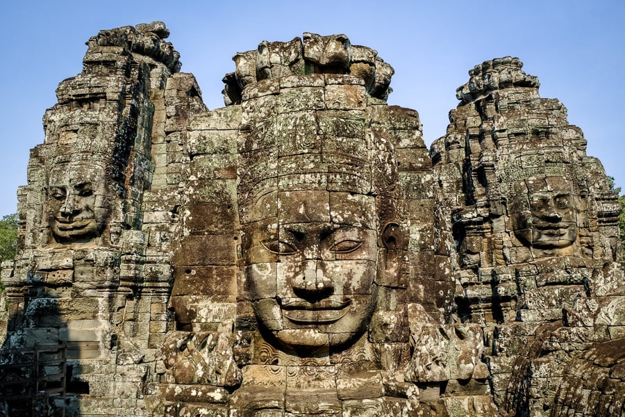 Giant stone faces at the Angkor Wat in Cambodia