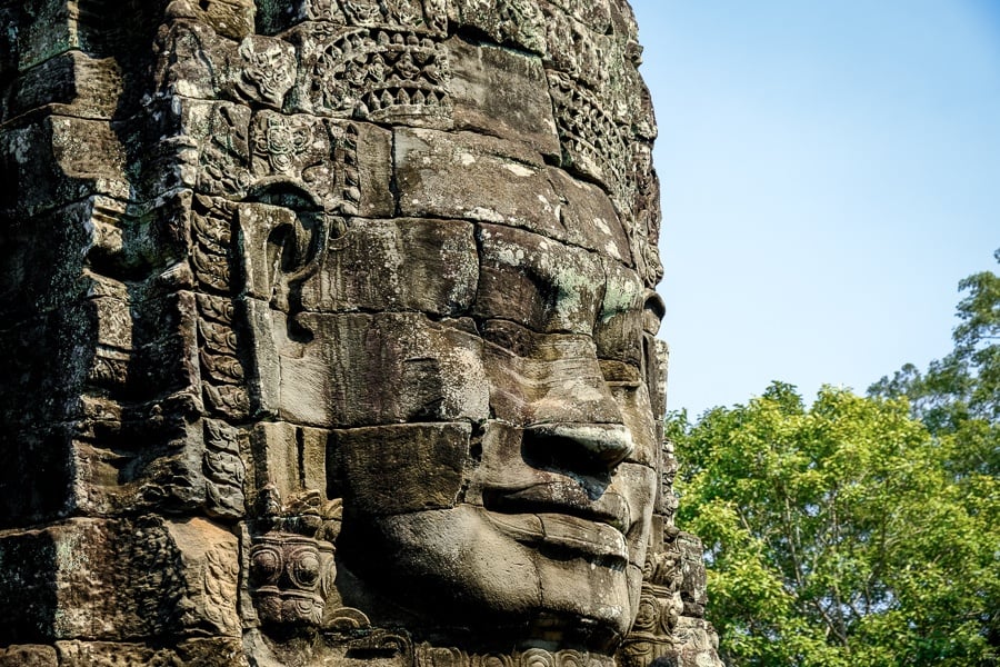 Carved stone face at the Angkor Wat temple in Cambodia